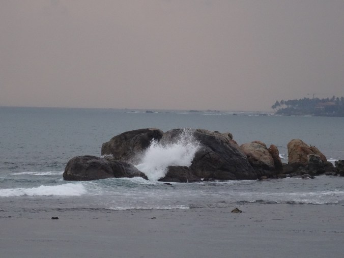 Waves crashing at sunset around Galle Fort