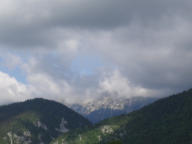 The distance Făgăraș Mountains loom over Măgura, Romania