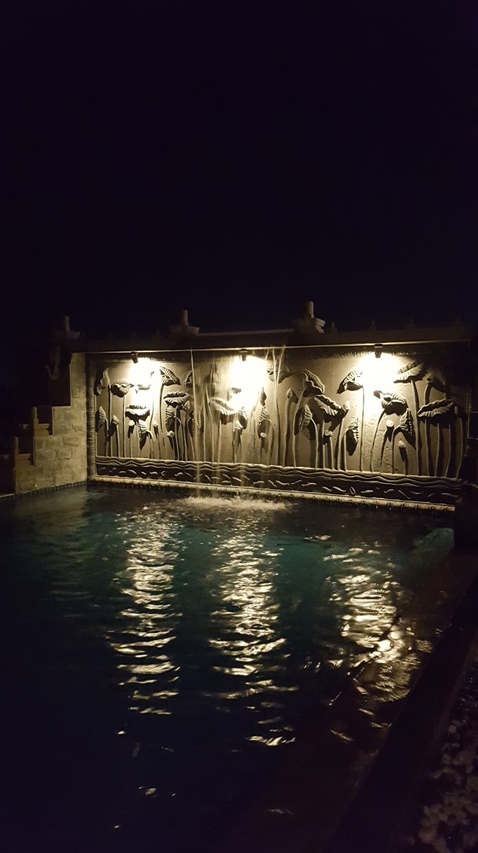 Roof top pool at night at Cyclo d'Angkor