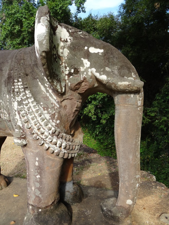 A carved elephant on the corner of the East Mebon